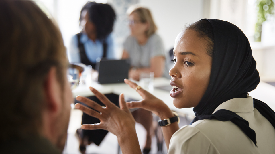 Students talking in a classroom