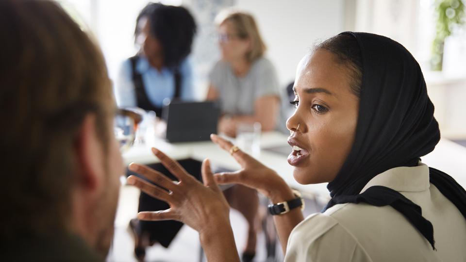Students talking in a classroom