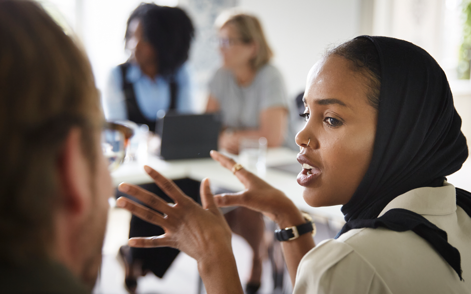Students talking in a classroom