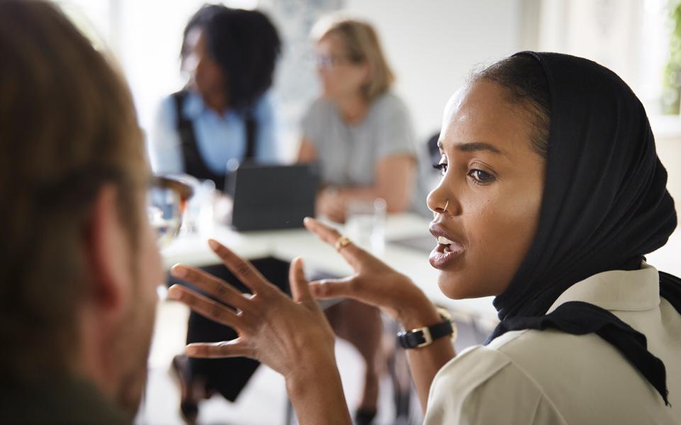 Students talking in a classroom